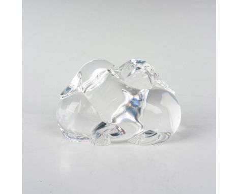 A clear crystal figural paperweight featuring two cute puppies with their long ears cuddling together. Baccarat etched backst