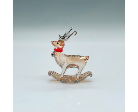 A beautiful and adorable golden shadow crystal deer with silver-tone metal horns. A red ribbon around the reindeers neck with