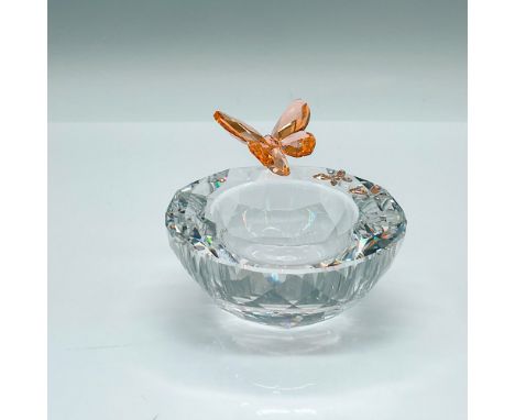 Part of the Spring and Easter promotion. A clear crystal candle holder decorated with a light peach crystal butterfly. Swarov