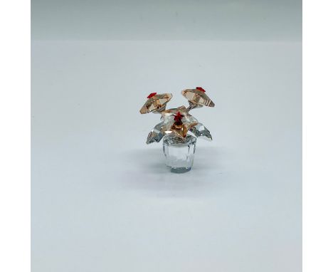 A small Christmas star flower figure. Light Siam satin blossoms and comet agent crystal leaves. Swarovski marked. This item h