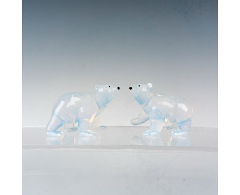 A beautiful Swarovski Crystal Society set of polar bear cubs made from white opal crystal with jet eyes and noses. Swarovski 