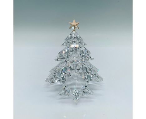 A beautiful tree figure formed as layers of star-shaped branches and a golden crystal star on top. Swarovski marked. This ite