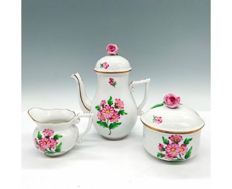 Hand-painted porcelain coffee service set. Design exhibits pink floral designs, basket weave textures, gold gilded rims, and 