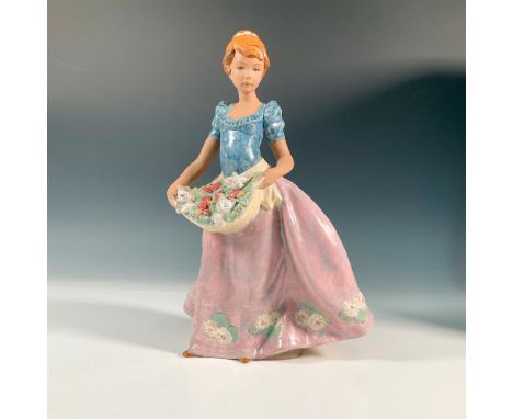 Gres finish figure modeled as a girl carrying a apron full of flowers with three adorable kittens resting in between the fres