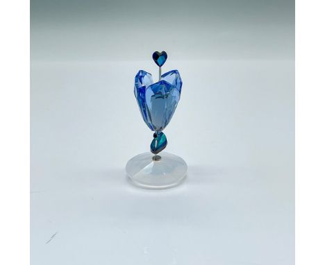 Beautiful light sapphire crystal petals and white opal blue crystal leaf. A heart-shaped pistil in jet metallic blue. The flo