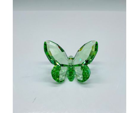 A light peridot-green crystal figurine. Swarovski marked. This item has its original box: 4.25"L x 4.25"W x 2.25"H. Issued: 2