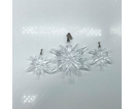 A set of 3 clear crystal Little Star ornaments in two different sizes. Swarovski marked. This item has its original box: 9.75