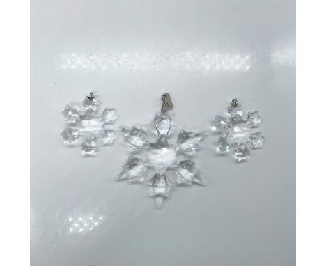 A set of 3 clear crystal Little Snowflake ornaments in two different sizes. Swarovski marked. This item has its original box: