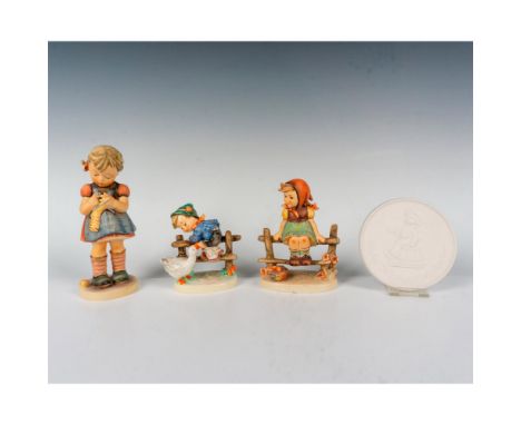 A set of 3 Goebel Hummel figurines that consisting of Just Resting which depicts a young girl seated at a wooden fence with a