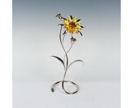 Swarovski crystal Paradise flower, named Darigold, reflects the brilliance of sunshine indoors. Inspired by the bur marigold,