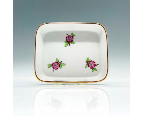 Hand-painted porcelain ring tray. The design features tiny pink blossoms, gold-gilded edges, and a rectangular shape. Herend 