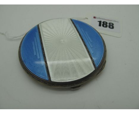 A Hallmarked Silver and Enamel Powder Compact, of circular form, highlighted in blue and white, allover engine turned, B's, B