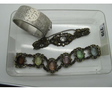 A Wide Hallmarked Silver Bangle, of part foliate design, together with a cameo panel style bracelet, of openwork design, cabo