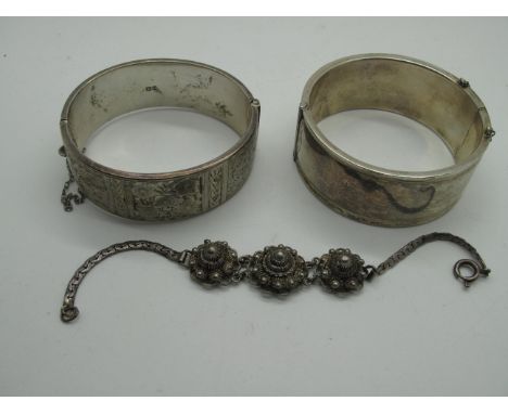 A Chester Hallmarked Wide Silver Bangle, of part foliate design (damages), another similar, together with a decorative panel 