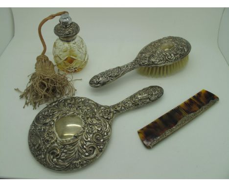 A Hallmarked Silver Backed Hair Brush, together with a mirror, comb and scent spray. (4) 