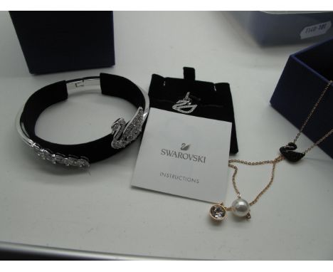 Swarovski; A Small Collection of Crystal Jewellery, including an ornate bangle, a pendant and a necklet with black swan detai