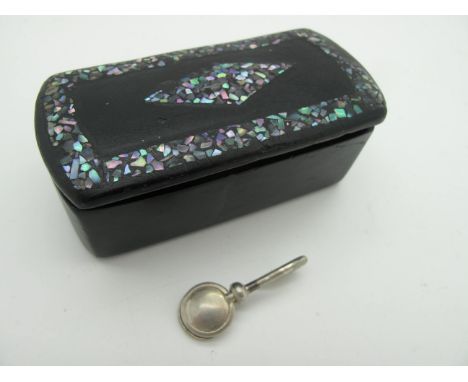 A Hallmarked Silver Napkin Hook, together with a XIX Century black lacquer snuff box, with shell decoration. (2)