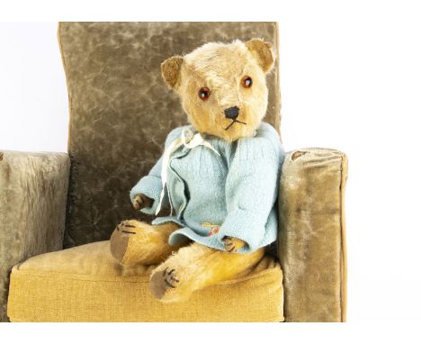 A Post-war Chiltern Hugmee golden mohair teddy bear, with orange and black  glass eyes, swivel head, fully jointed, with claw