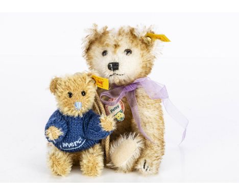 Two small Steiff yellow tag teddy bears, a miniature Petsy with purple ribbon and card tag and a smaller teddy bear in blue k