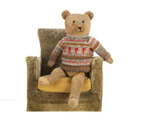 A 1930s German teddy bear,  with short golden mohair, replace boot button eyes, swivel head, jointed limbs, inoperative growl