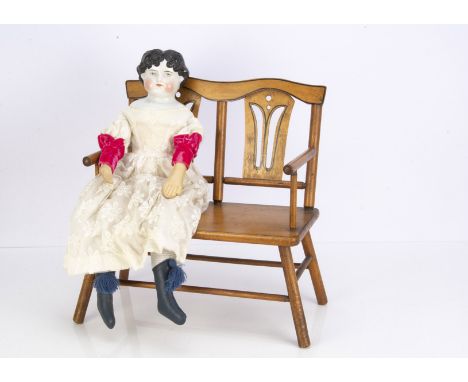 An Alt Beck &amp; Gottschalck 1046 china shoulder head doll, with blue painted eyes, black painted and moulded centre-parted 