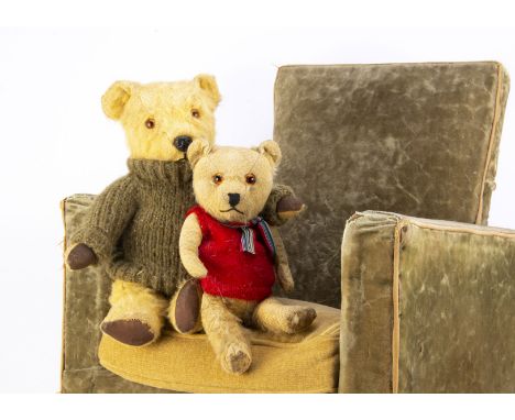 Two Post-war Chiltern Hugmee teddy bears,  one with orange and black glass eyes, swivel head and jointed limbs and the other 