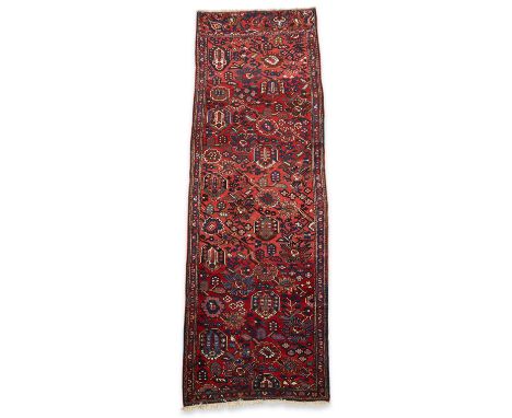 Persian-Bakhtiari (Iran) hand knotted wool on cotton hallway runner rug, mid to late 20th century. With an allover pattern on