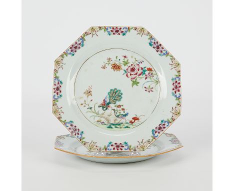 Pair of Chinese Qianlong famille rose octagonal plates, 18th century. Decorated with peacocks and blooming flowers with a bor