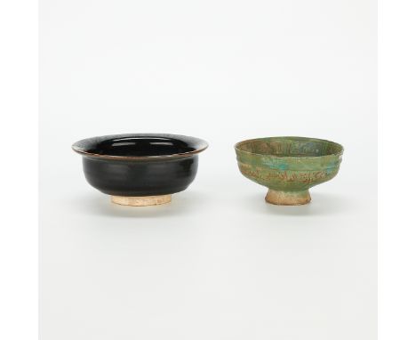 Two ceramic bowls with repairs. One Chinese Yuan dynasty black glazed ceramic bowl. One archaic Persian bowl in green with re
