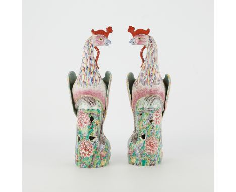 A fine and rare mirror pair of Chinese export porcelain phoenix, each decorated in famille rose enamels on a well molded body