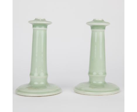 Pair of Nabeshima porcelain candlesticks, decorated with a pale celadon glaze.Each; height: 7 1/4 in x diameter: 4 3/4 in.Con