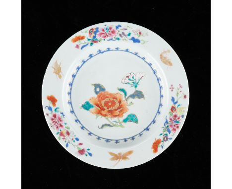 Chinese famille rose porcelain plate decorated along the interior with a blooming flower, 18th century. Decorated along the r