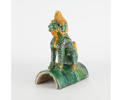 Chinese ceramic sancai roof tile in green and ochre pigments in the form of a Qilin or Kylin. The mythical beast is modelled 