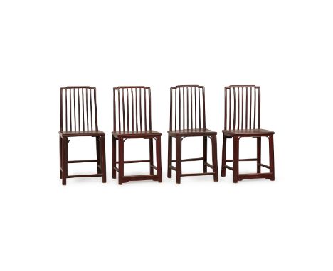 Set of four Chinese lacquered spindle back side chairs. The curved top rails fitted flush with the corner posts of the round 
