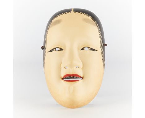 One Ko-omote "small face" Noh mask. Carved wood with pigments. With a Japanese inscription along interior of mask. In a woode