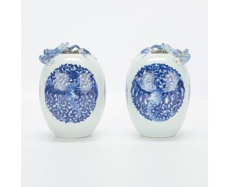 Pair of 19th to 20th century Chinese porcelain blue and white urns or vases. Each painted with three circular depictions of p