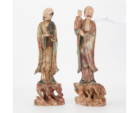 A striking and unusually large pair of 19th century Chinese immortals or scholars carved from soapstone and polychromed. Each