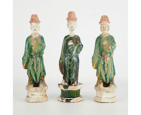 Group of three ceramic mingqi mortuary or spirit tomb figures in sancai green and ochre glazes, possibly Ming dynasty. In the