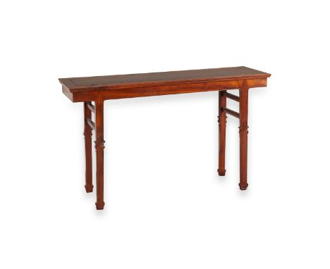 One 19th century Chinese rosewood altar table. Rectangular with plain apron; square legs with carved knees and scrolled carve