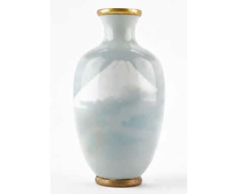 Japanese cloisonne vase with a pale blue ground and a landscape of Mount Fuji rising from the clouds. The cloisons have been 