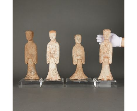 Group of four Chinese mingqi funerary or spirit figures, likely Han dynasty. Unglazed pottery with white slip. Two depicting 