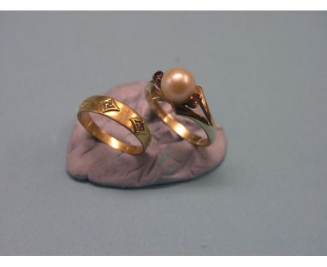 An 18ct. gold ring, set three rose-cut diamond ships, size L, and a 9ct. gold ring, set pearl-type stone and two ruby chips, 