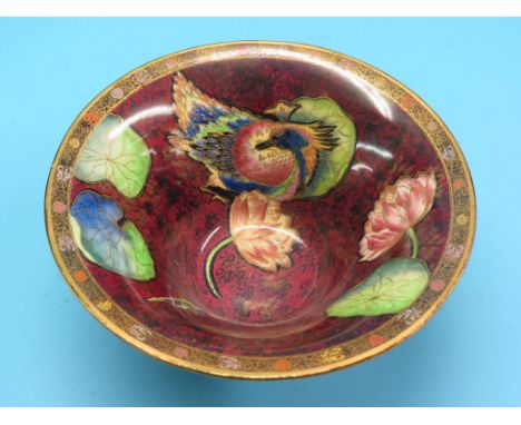 A Carlton Ware lustre bowl, circular everted form with Crested Bird and Water Lily pattern against a gilded crimson ground, p