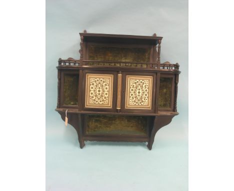 A Victorian ebonised shelf unit, in Anglo Indian style, pair of bone cupboard doors inlaid with micro-mosaic design, shelves 