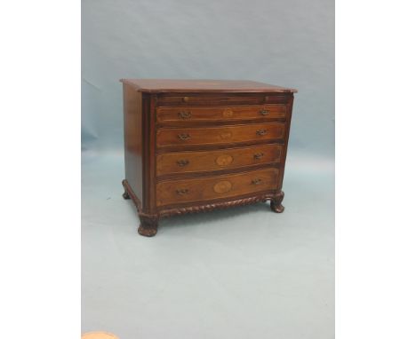 A George III-style inlaid mahogany commode, serpentine-fronted with brushing slide and four graduated drawers, inlaid bats-wi