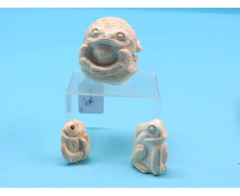 An early 20th century ivory netsuke, carved in the form of a fish, and two larger ivory frog models, frogs signed, 3in.  Ship