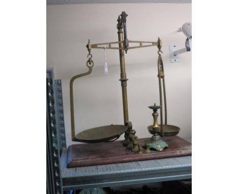 A Victorian brass weighing scale, to weigh 3lbs., mahogany plinth with five brass weights, together with a period-style brass