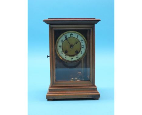 A late 19th century walnut mantel clock, circular dial and French gong-striking movement, with key and pendulum, 12in.