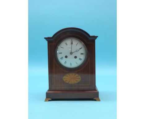 An Edwardian inlaid mahogany mantel clock, with convex enamelled dial and French Mougin gong-striking movement, on brass brac