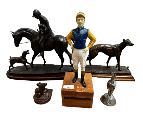 Five various modern decorative sculptures to includeA modern bronzed style resin sculpture of a whippet, raised on wooden pli